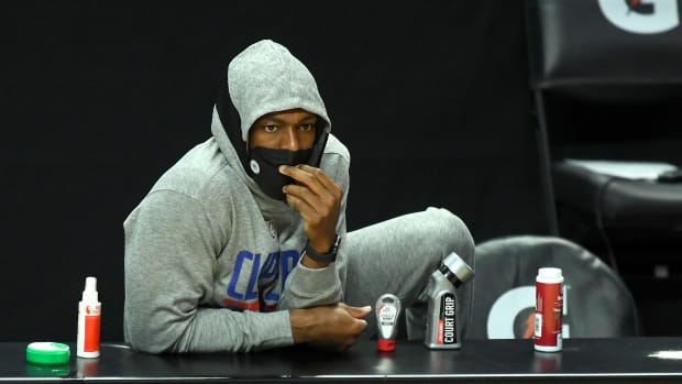 Mar 30, 2021; Los Angeles, California, USA; Los Angeles Clippers guard Rajon Rondo (7) looks on from the bench during the first quarter against the Orlando Magic at Staples Center. Mandatory Credit: Jayne Kamin-Oncea-USA TODAY Sports